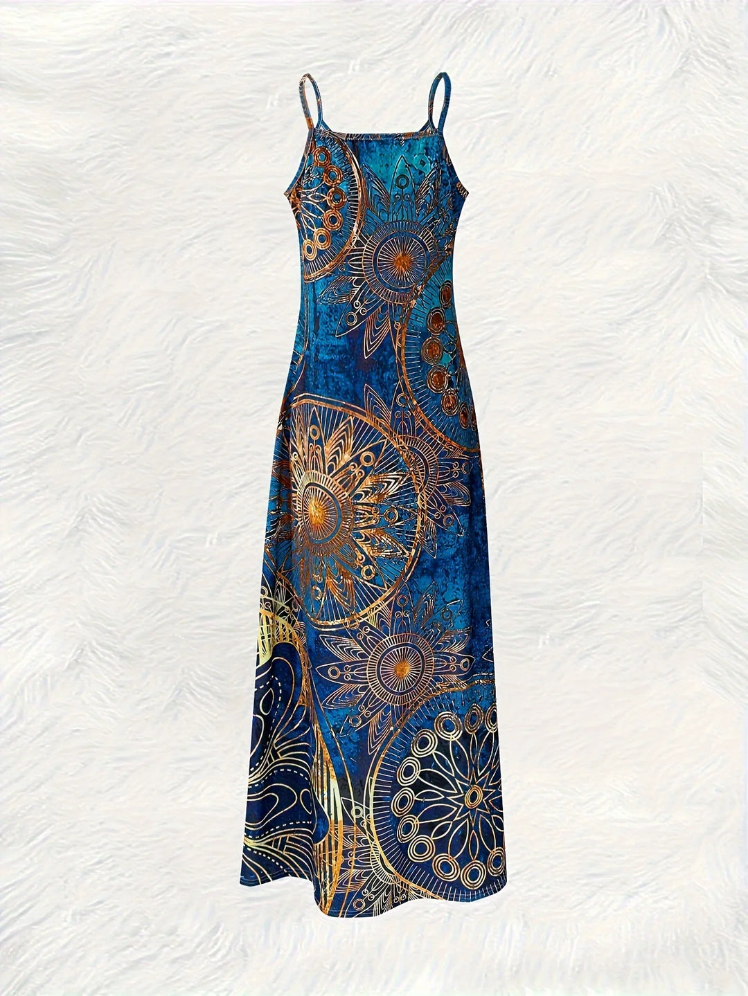 Bohemian-inspired maxi dress featuring a vibrant blue-and-gold totem print. Halter-neck, sleeveless cut with a slim fit and flow